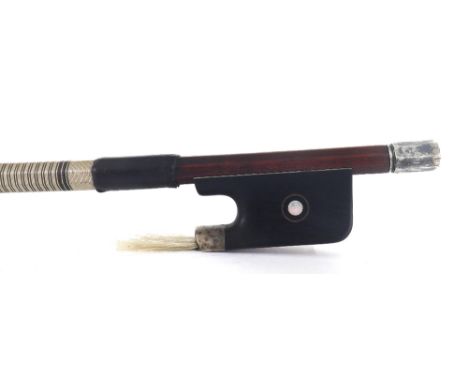 Silver mounted violoncello bow stamped C. Thomassin á Paris, the stick round, the ebony frog inlaid with silver rings enclosi