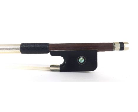 Nickel mounted violin bow stamped Louis Bazin, the stick round, the ebony frog inlaid with silver rings enclosing pearl eyes 