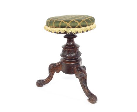 Victorian music stool, the stuffover seat above a turned carved tripod base