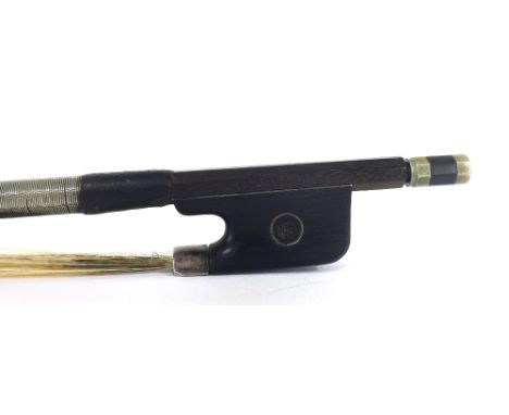 French silver and nickel mounted violin bow by and stamped Vtor.Fetique á Paris, the stick round, the ebony frog inlaid with 