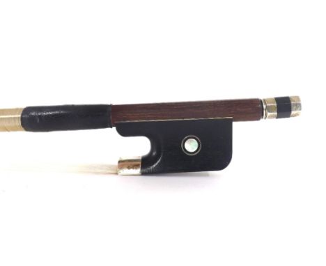 Silver mounted violoncello bow, unstamped, the stick octagonal, the ebony frog inlaid with silver rings enclosing pearl eyes 