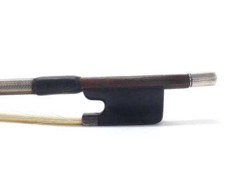 French silver mounted violin bow by and stamped Leon Piqué, the stick octagonal, the ebony frog plain and with a silver overl