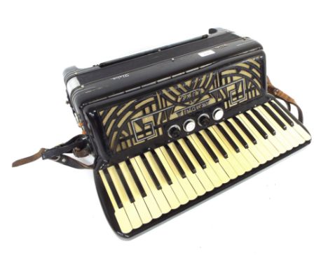Armonia De Luxe Piano Accordion, with Octave bass and Treble stops. (case) This accordion was previously owned by Joan Alexis