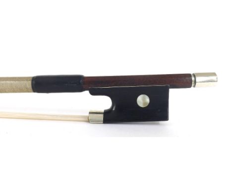 Nickel mounted violin bow stamped René Bailly, the stick round, the ebony frog inlaid with pearl eyes and with a nickel overl