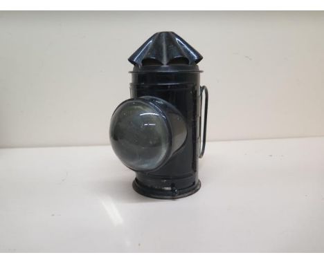 A vintage policeman's lamp with bullseye glass 