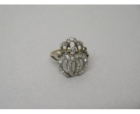 A Georgian yellow gold diamond ring - the rose cut diamonds set in a double horseshoe with split shoulders - good overall con