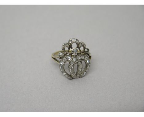 A Georgian yellow gold diamond ring - the rose cut diamonds set in a double horseshoe with split shoulders - good overall con