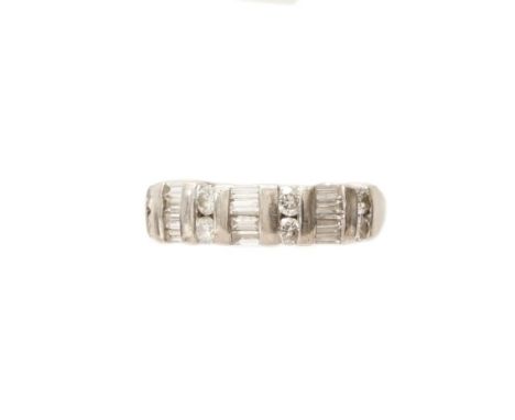 A good 18ct white gold and diamond half eternity ring set with eight round brilliant cut diamonds and twelve baguette cut dia