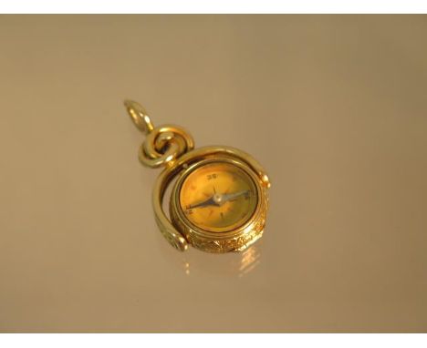 An unusual 9ct (tested) yellow gold swivel fob set with compass (working) finely chased case hinged to open - approx 4cm - we