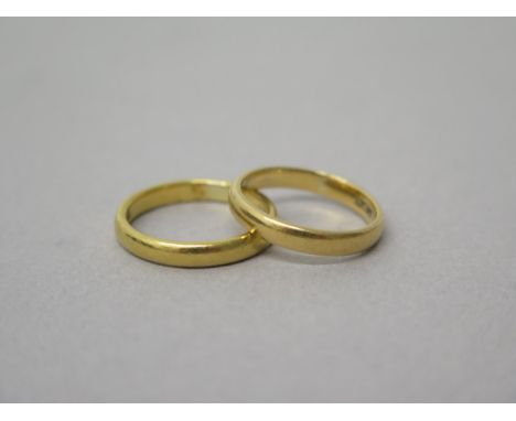 Two 22ct yellow gold (hallmarked) wedding bands - sizes L &amp; K - total weight approx 7 grams 