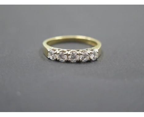 A good 18ct yellow gold five stone diamond ring - five even round brilliant cut diamonds - approx 0.8ct diamonds weight - rin