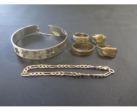 A selection of 9ct gold including two rings and bracelet - weight approx 11.5 grams with a silver bracelet/bangle - approx 21