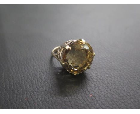 A large 9ct (tested) yellow gold and quartz ring - round quartz approx 2cm diameter - ring size L/M - good overall condition 