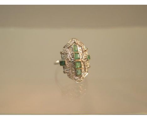 An Art Deco emerald and diamond ring set in platinum (tested) ring size M 