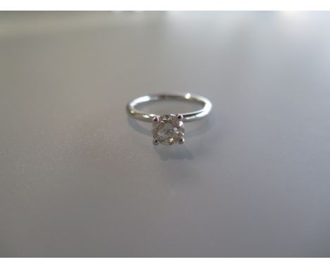 A diamond solitaire ring size M/N - diamond weight 1.02ct - stamped 14ct with AIG certificate - approx weight 2.7 grams 