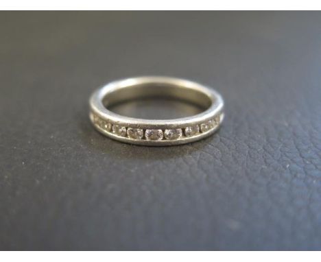 A platinum and diamond half eternity ring size L/M - weight approx 6.6 grams - with retailers certificate 