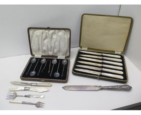 A boxed set of six silver coffee bean spoons with sugar tongs, Birmingham 1923 with a boxed set of six silver mother of pearl