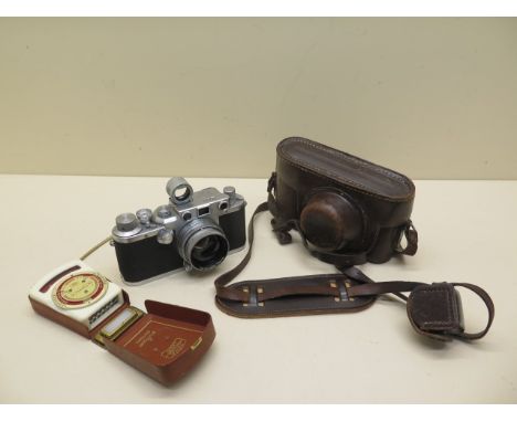 A 1949 Leica 111c 35mm camera number 472783 with leather case Summitar f=5cm 1:2 lens no 682503, 5cm range finder and a Ikoph