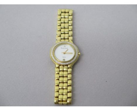 A ladies Maurice Lacroh quartz gold plated bracelet watch - round case 25mm with mother of pearl dial - working in the salero