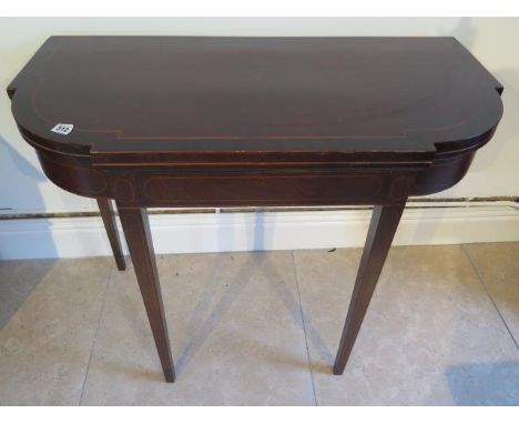 A 19th century mahogany and inlaid fold over card table on square tapering legs - Width 92cm 