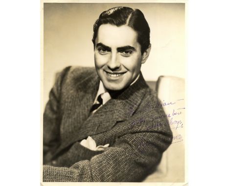 POWER TYRONE: (1914-1958) American Actor. Vintage signed and inscribed sepia 11 x 14 photograph of Power seated in a smiling 