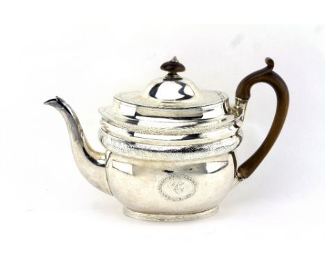 A GEORGIAN SILVER TEAPOT of large proportions with engraved decoration, a fruitwood finial and handle, by William Bennett, wi