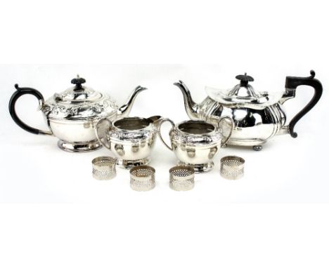 A SILVER BATCHELORS TEAPOT of bulbous shaped form with ebonised trophy handle standing on four bun feet, bearing marks for Bi