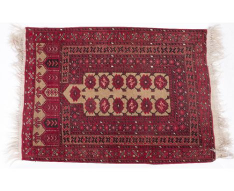 TWO MID TO LATE 20TH CENTURY MIDDLE EASTERN GROUND RUGS one on a cream biscuit coloured ground with repeating architectural m