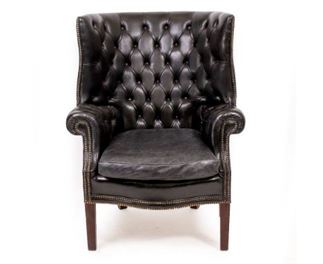 A BLACK LEATHER BUTTON UPHOLSTERED PORTERS ARMCHAIR with square tapering legs 85cm wide x 71cm deep x 113cm high 