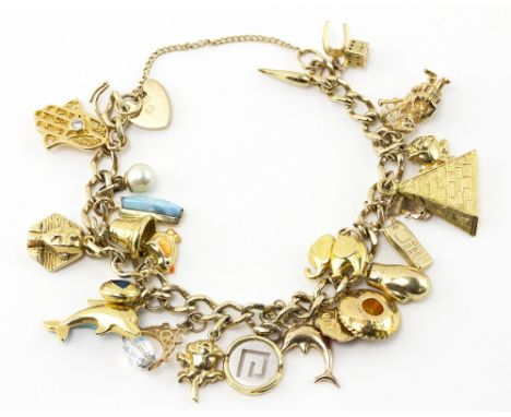 A 9CT YELLOW GOLD GATE CHARM BRACELET with a quantity of charms to include 9ct and other unmarked yellow metal examples, 41 g