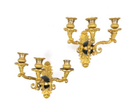 A PAIR OF ORMOLU THREE BRANCH WALL LIGHTS the three scrolling branches emanating from a central painted globe, 23cm wide x 24