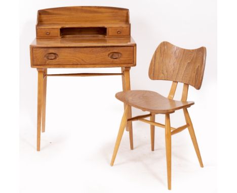 AN ERCOL LIGHT ELM SMALL SIZE DESK with a raised back, having two short drawers above one frieze drawer with square tapering 