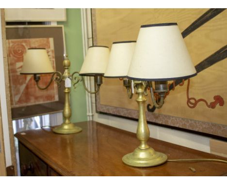 A PAIR OF TWIN SCROLLING ARM TABLE LAMPS with knopped finial on circular spreading base 43cm x 46cm approximately (2)