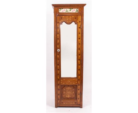 A 20TH CENTURY MARQUETRY INLAID NARROW CUPBOARD  or single wardrobe with shaped mirror plate door, ceramic handle inset with 