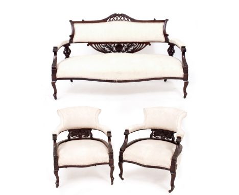 AN EDWARDIAN PARLOUR SUITE consisting of an open arm settee and two matching tub chairs, each with cabriole legs and ceramic 