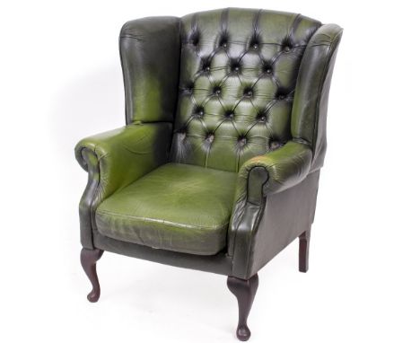 A GREEN LEATHER BUTTON UPHOLSTERED WING BACK ARMCHAIR 77cm wide x 72cm deep x 102cm high