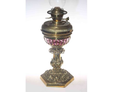 Victorian brass and ruby glass oil lamp, 68cm