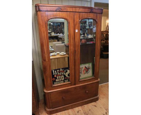 Victorian mahogany wardrobe having two mirror panelled doors above a deep drawer, 202cm by 118cm