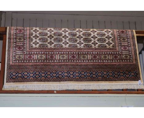 Bokhara carpet with a beige ground, 2.30 by 1.60