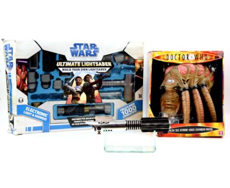 A Star Wars Graflex metal bodied replica lightsaber with display stand, a Hasbro Star Wars Ulitimate Lightsaber (boxed) and a