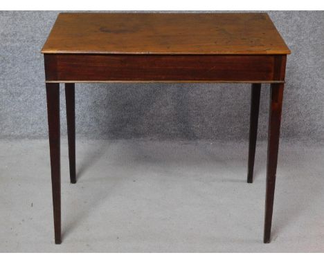 A Georgian mahogany lamp table on square section tapering supports. H.71 W.78 D.49cm