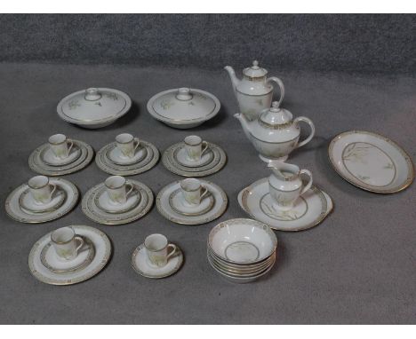 A Royal Doulton White Nile pattern part dinner service, including coffee pot, tea pot and coffee cups. Makers stamp to base. 