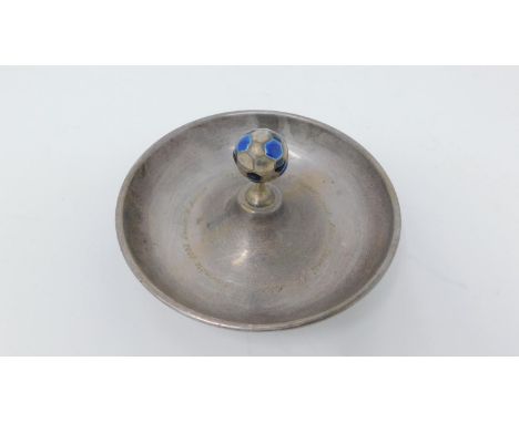 A continental silver and enamel UEFA champions league trophy. A silver doughnut shaped dish with a small blue and black ename