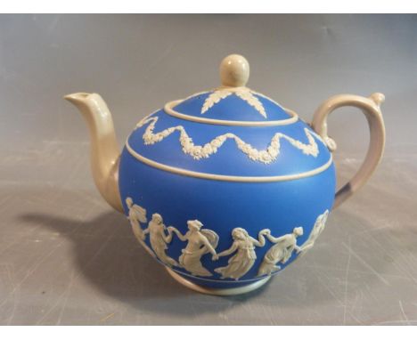 A 19th century Copeland blue and white jasperware dancing hours tea pot. It features a raised classical relief pattern of swa