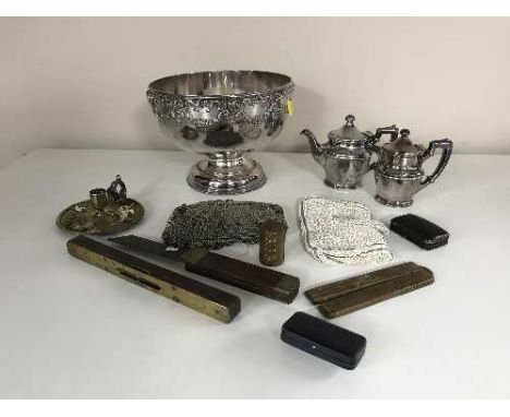 A crate of silver plated punch bowl, jewellery boxes, old rulers, mesh purse, brass chamber stick etc 