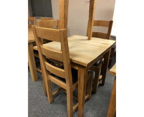 A square oak table and pair of ladder back chairs 