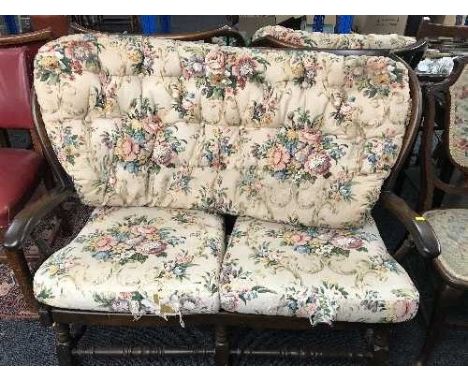 An Ercol cottage style settee, an armchair and a rocking chair 