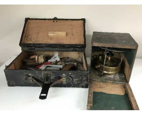 An old tool box with tools together with an antique paraffin lamp in box 