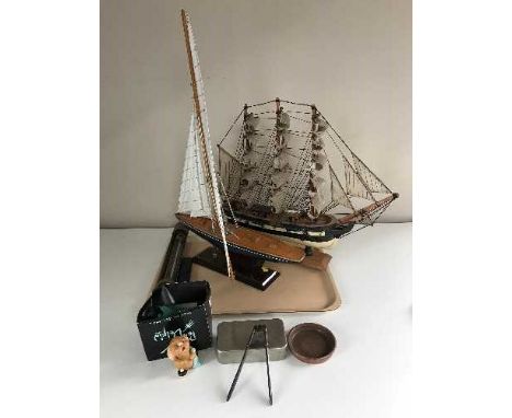 A tray of two model galleons, thermometer etc 