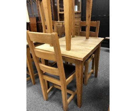 A square oak table and pair of ladder back chairs 